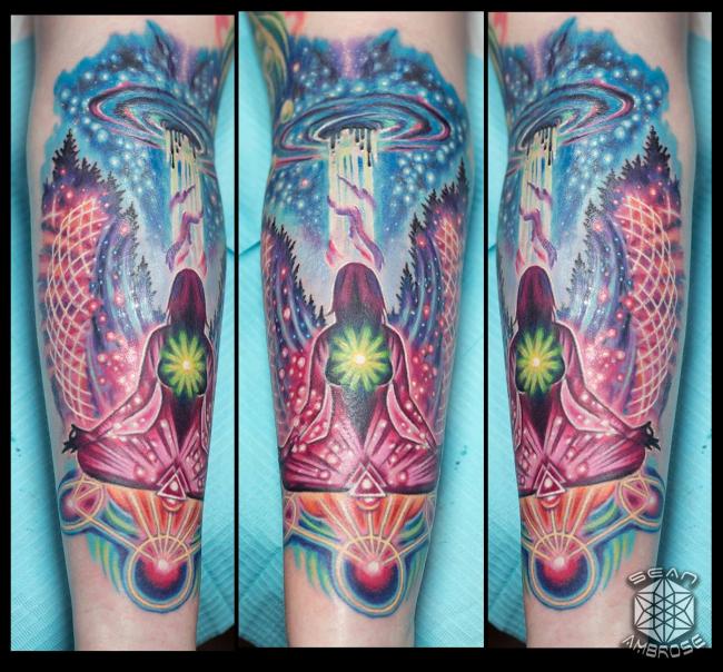 Custom colorful cosmic meditation and chakra tattoo by Sean Ambrose of Arrows and Embers Tattoo in Concord, New Hampshire (NH). Sean specializes in realism and surrealism custom Tattoos. He has been awarded as the Best Tattoo Artist in NH multiple years from multiple publications, and also won handfuls of awards for his tattoos and art.