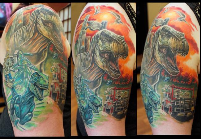 Custom realistic colorful Lego Dinosaur (Raptor) tattoo by Sean Ambrose of Arrows and Embers Tattoo in Concord, New Hampshire (NH). Sean specializes in realism and surrealism custom Tattoos. He has been awarded as the Best Tattoo Artist in NH multiple years from multiple publications, and also won handfuls of awards for his tattoos and art.